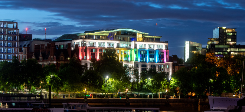 Globe House lighted lit up in Pride colours